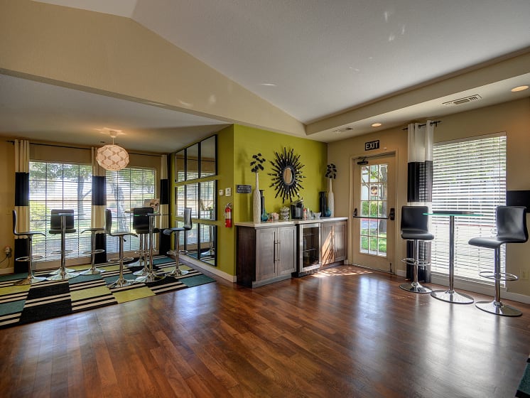 Office With Coffee Bar, Hardwood Inspired Floor, Windows and Green Walls